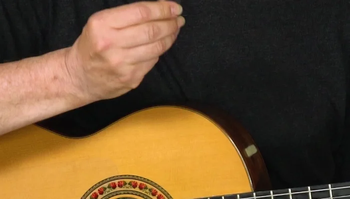 Attach a small piece of Velcro to your pick.