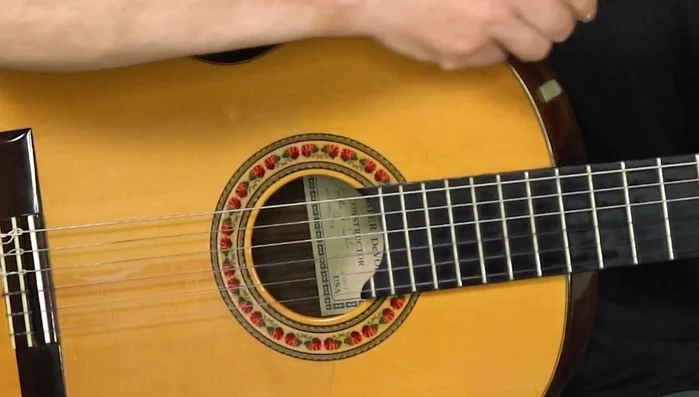 Attach a larger piece of Velcro to your guitar.