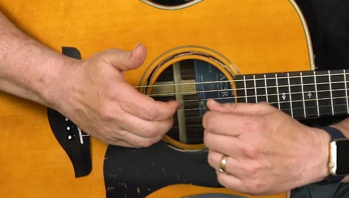 Wrap your thumb around the pick slightly.