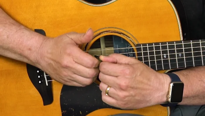 Wrap your thumb around the pick slightly.