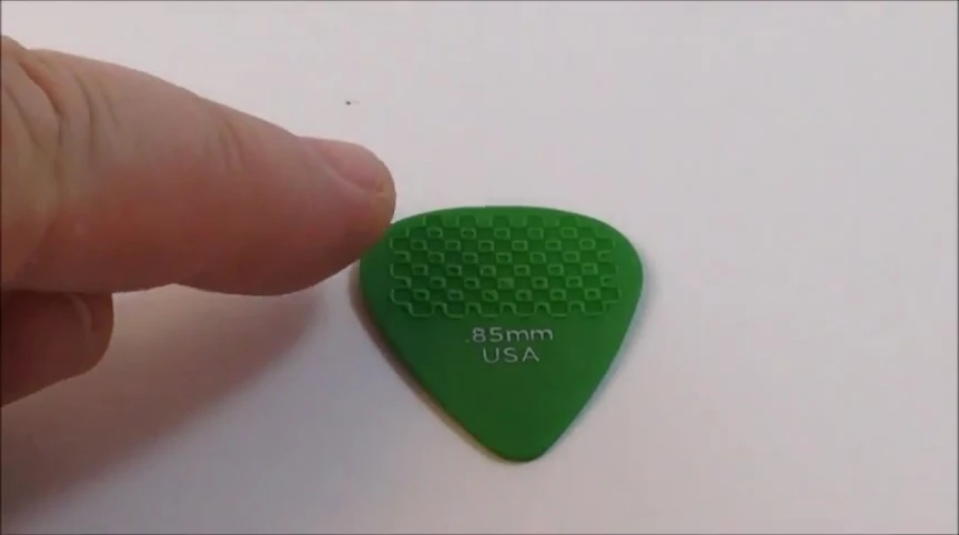 Close-up showing the textured grip surface of the pick.