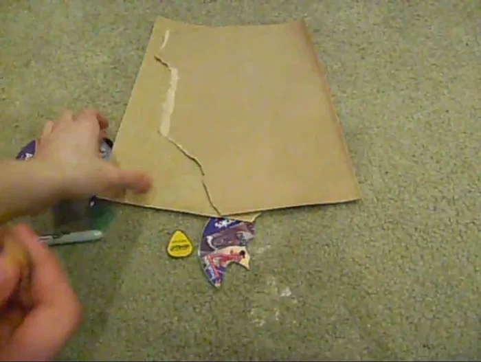 Remove any printed labels or film from the CD using sandpaper. This step is particularly important for CDs with printed designs.