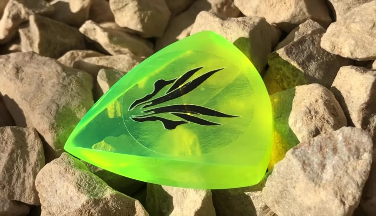 Close-up of the green acrylic Attack Drop pick