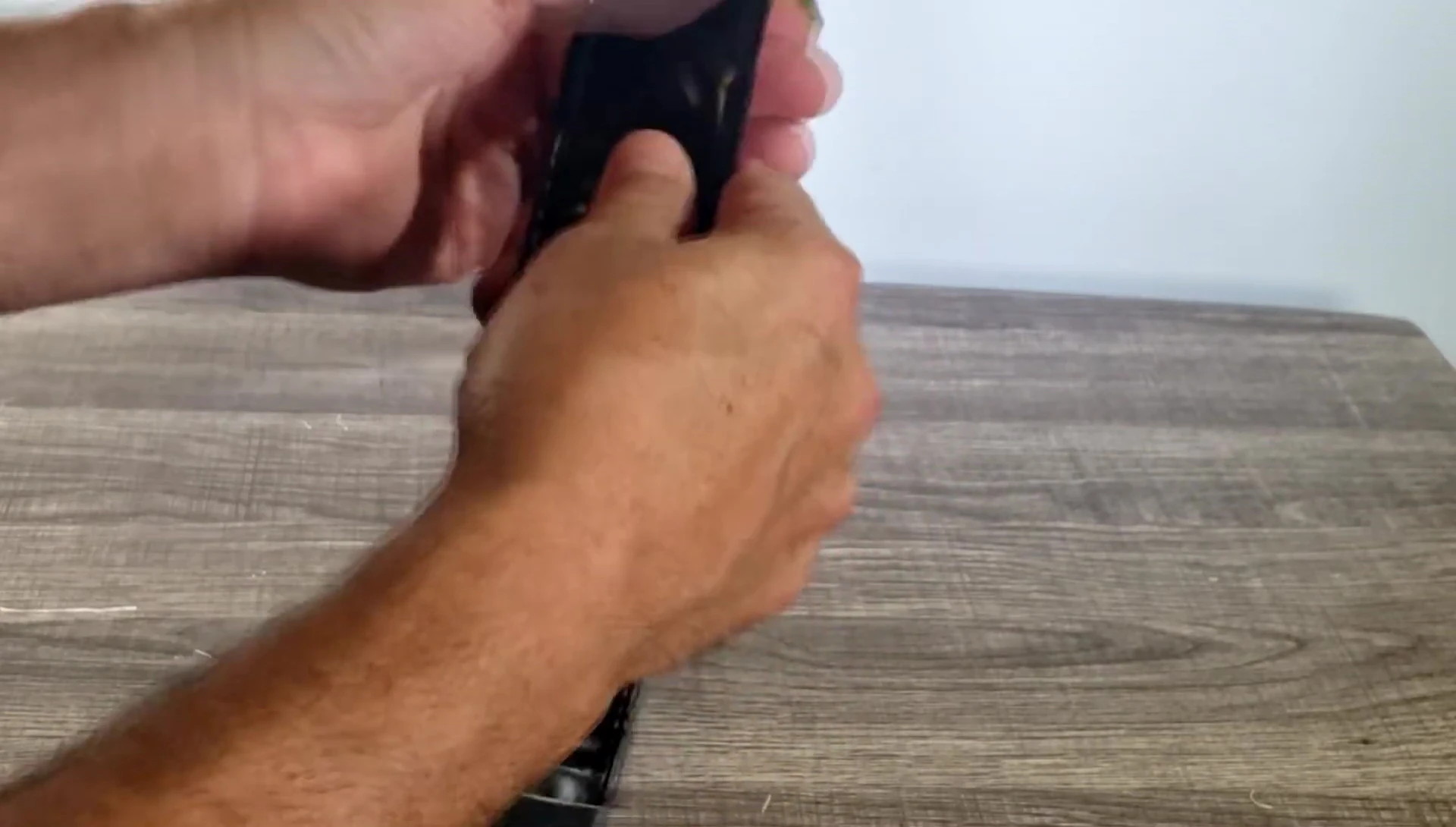 The reviewer demonstrating the padding of the strap.