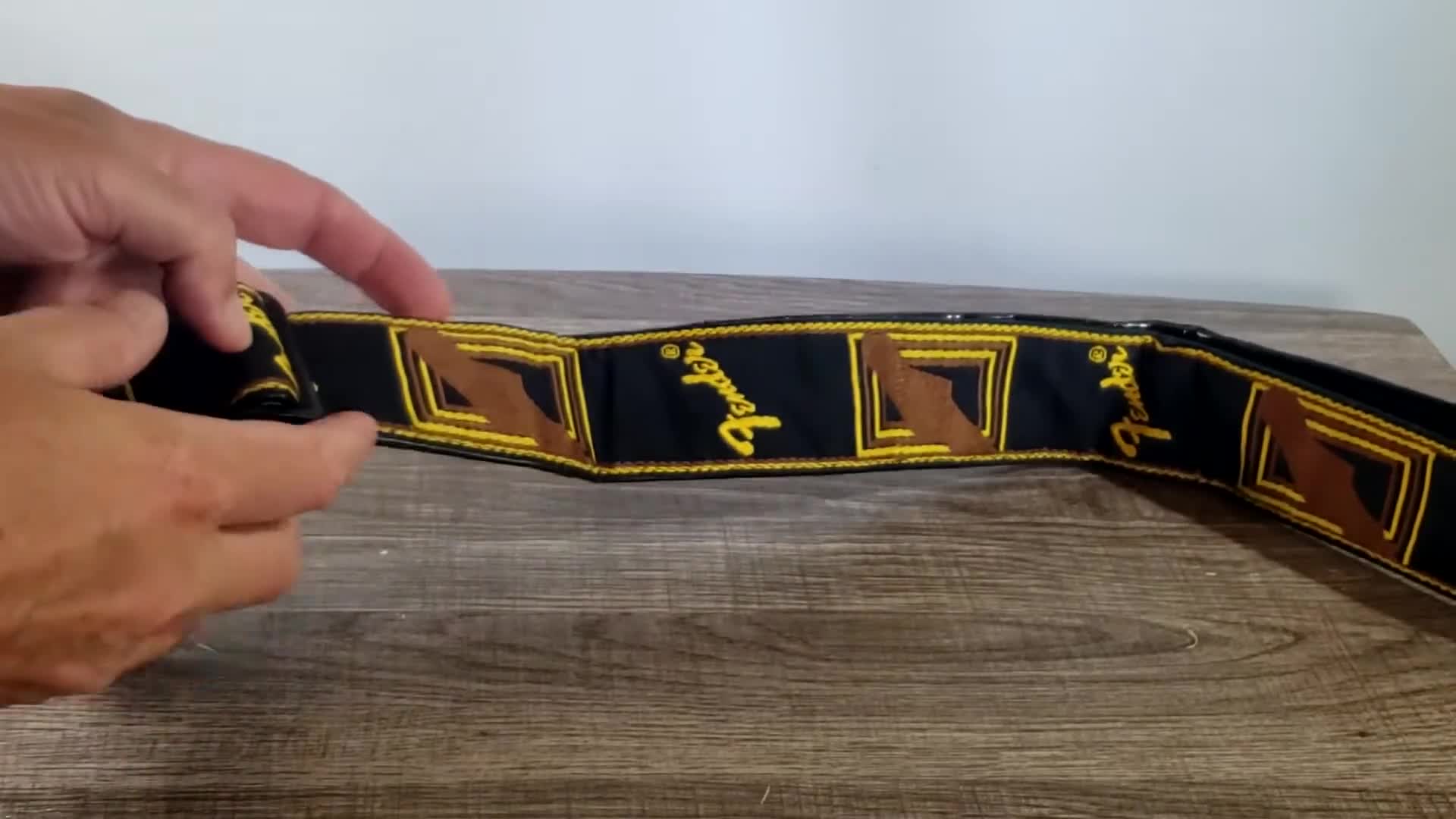 Showcasing the padded width and adjustable feature of the strap.