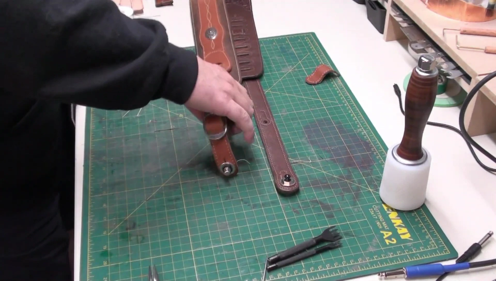 The completed strap repair; showing the alignment and stitch work.