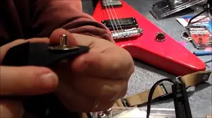 Guitar Strap Locks: A Comprehensive Review of Schaller, Dunlop, and DiMarzio