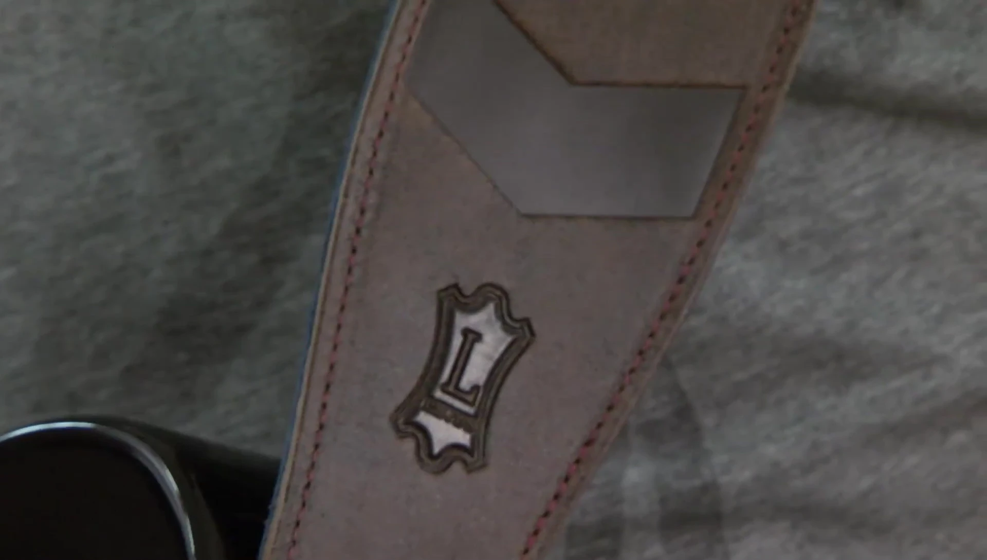 The Distressed Chevron strap displayed with its embossed pattern visible.
