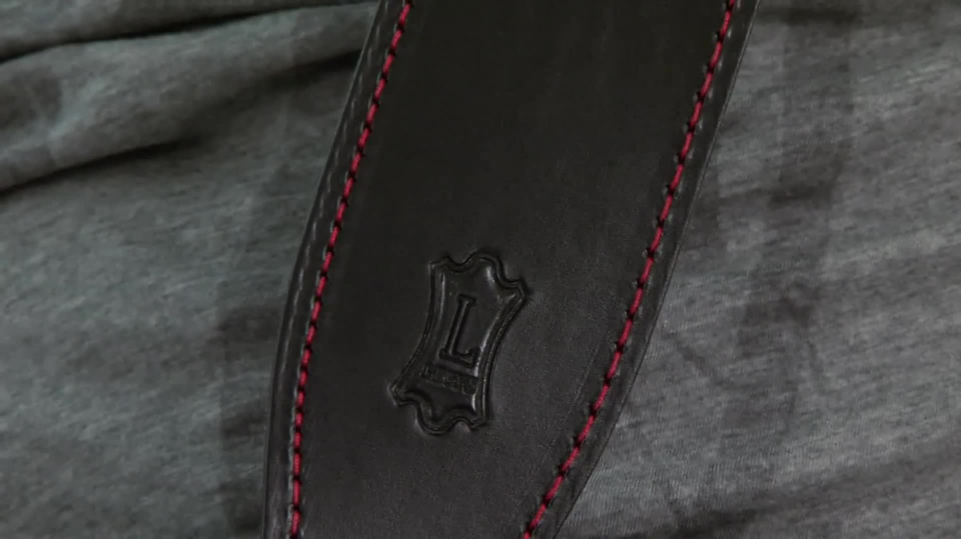 Close-up of the MVR1 17 guitar strap showing the red stitching and vegetable-tanned leather.