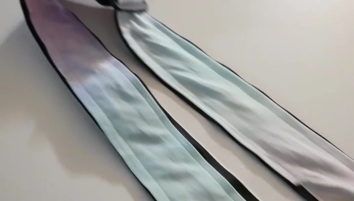 Attach the strap to the guitar.