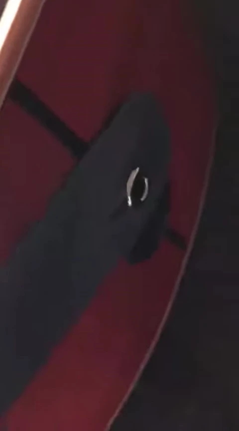 Strap on the guitar pegs