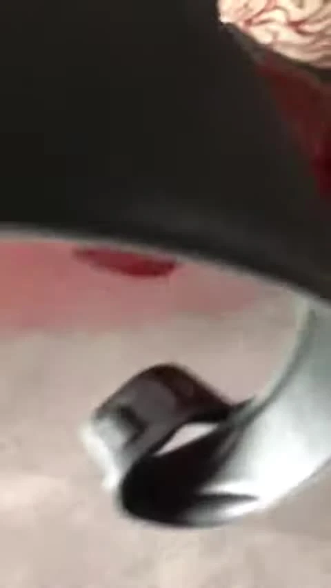 Hand holding the strap to show the supple leather