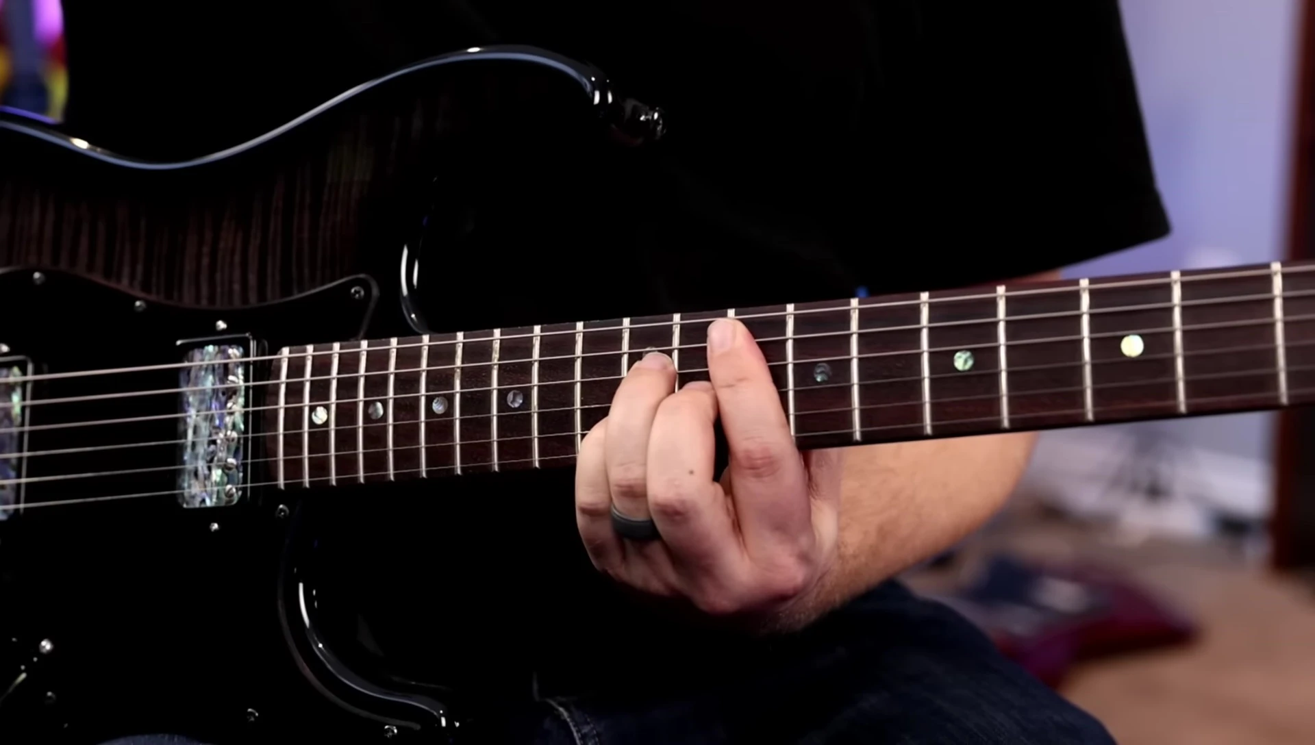 A guitar with humbucker pickups showing coil-splitting switches