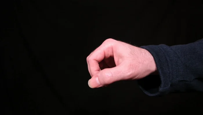 Keep your hand relaxed. Avoid clenching your fist; this is unnecessary tension.