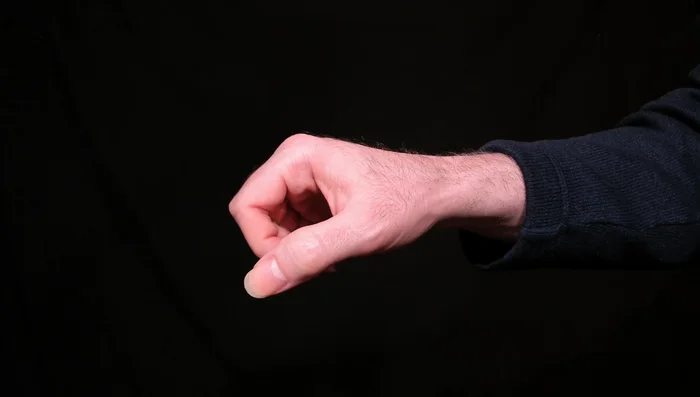 Keep your hand relaxed. Avoid clenching your fist; this is unnecessary tension.