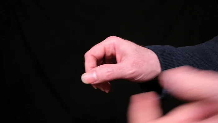 Keep your hand relaxed. Avoid clenching your fist; this is unnecessary tension.