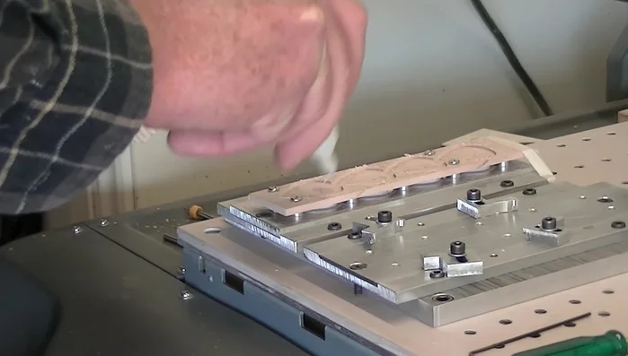 Apply CA glue to harden the wood grain and fill the pores, especially in the engraved area. Let it dry.