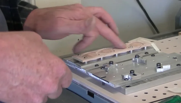 Sand the surface to smooth it and remove excess glue.