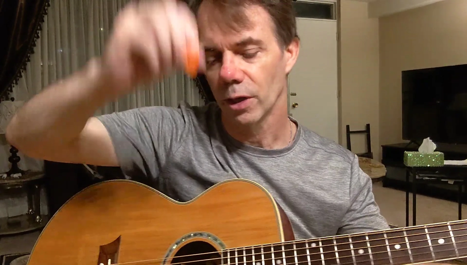 The reviewer plays the acoustic guitar with the D'Addario Duragrip pick.