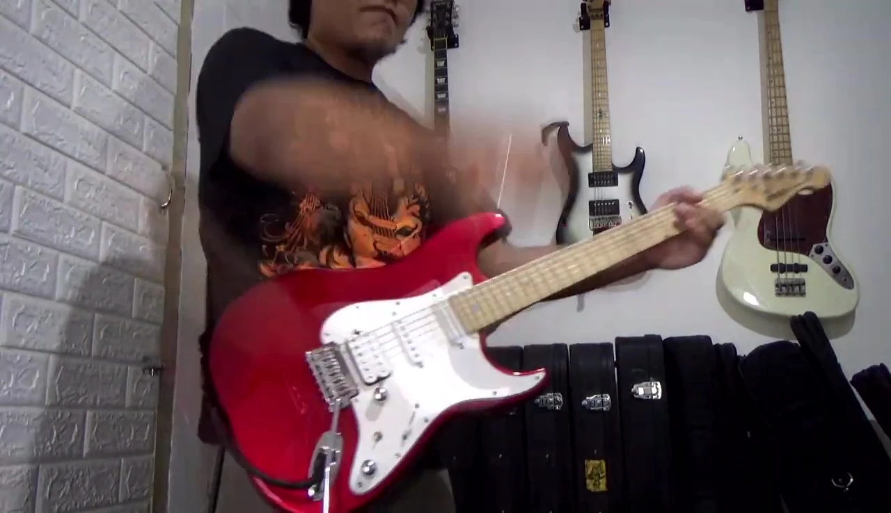 Final shot of the guitarist with the strap.