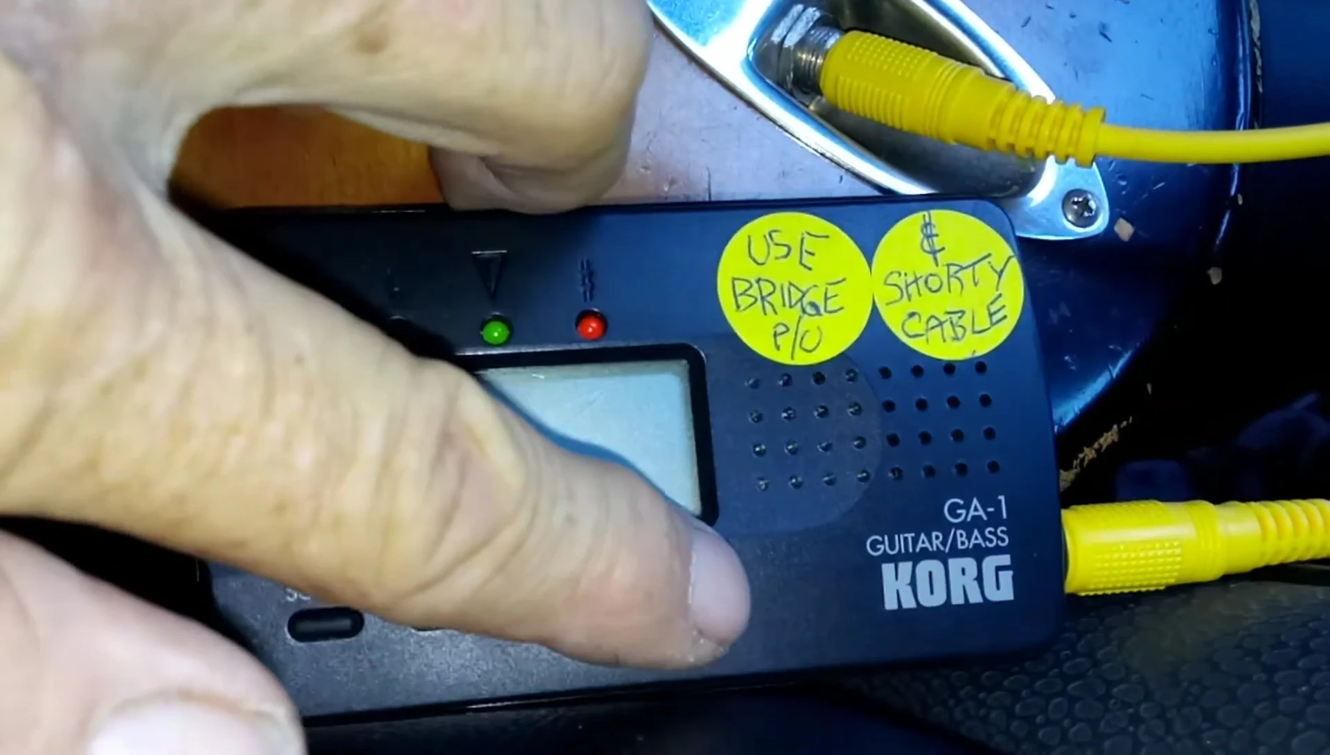 The Korg GA-1 tuner display showing the Drop D tuning.