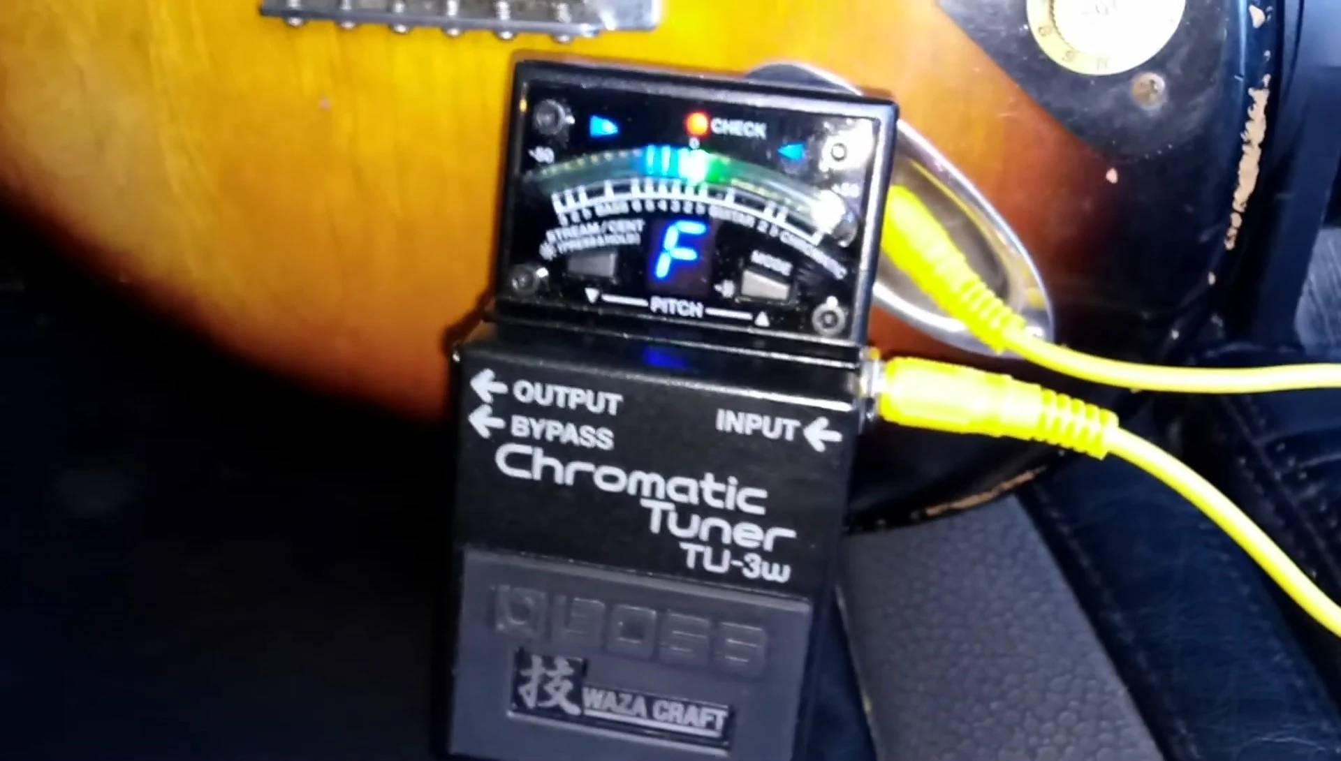 The Boss TU-3W tuner displaying erratic readings.