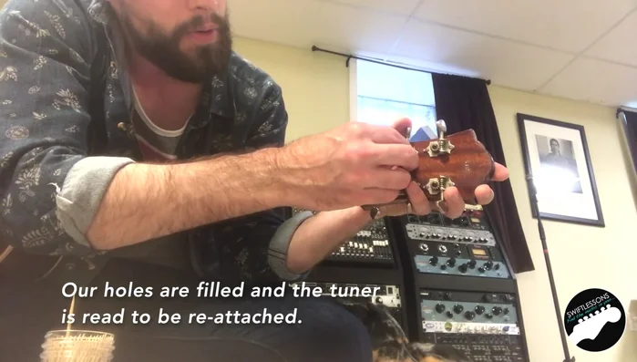 Reattach the tuner and tighten the screws.