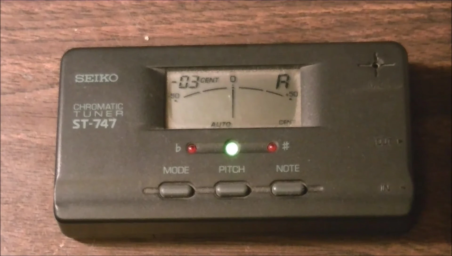 Comparison shot showing the Seiko tuner next to the Ibanez tuner.