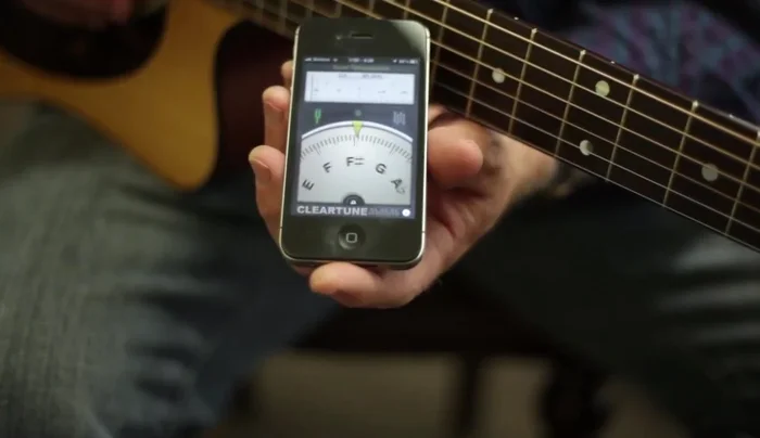 Download a guitar tuning app (like ClearTune) onto your smartphone.