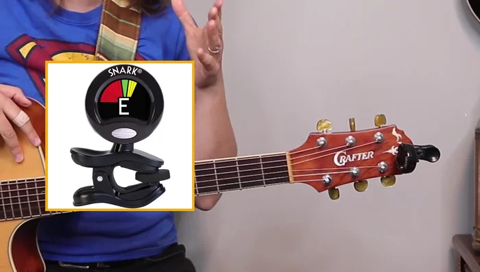 Attach the tuner to the headstock of your guitar.