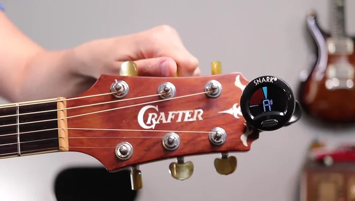 Fine-tune each string until the tuner shows the correct note with a stable green light.