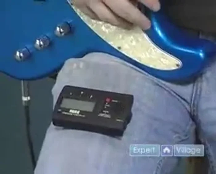 If the needle is below the center, tighten the tuning peg. If it's above, loosen it.