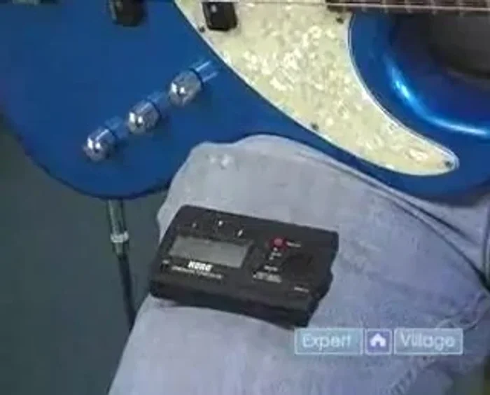 If the needle is below the center, tighten the tuning peg. If it's above, loosen it.