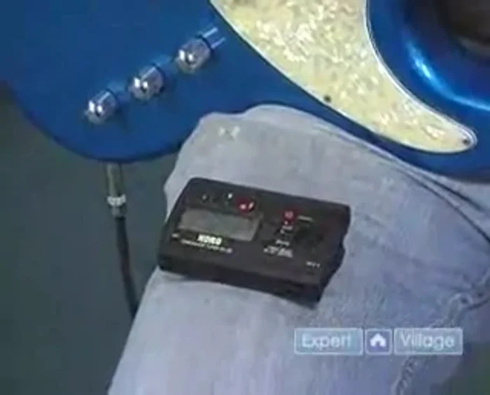 If the needle is below the center, tighten the tuning peg. If it's above, loosen it.