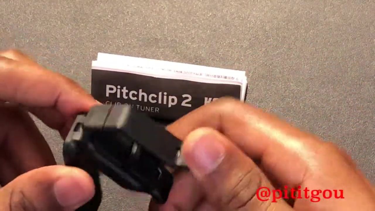The reviewer holding the Korg Pitchclip 2.