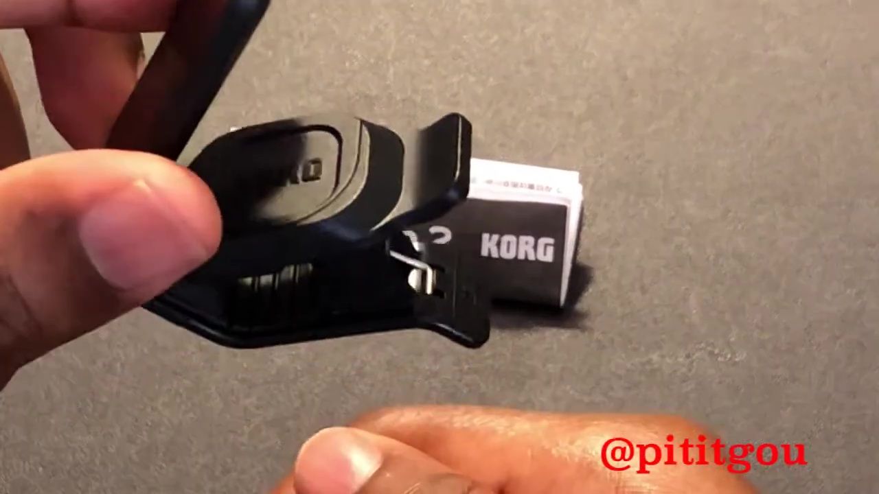 The Korg logo visible on the inside of the tuner.