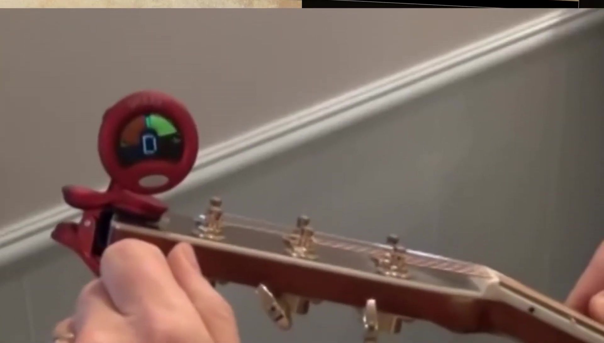 Close-up of the Snark ST-8 tuner showcasing its black casing and clip.