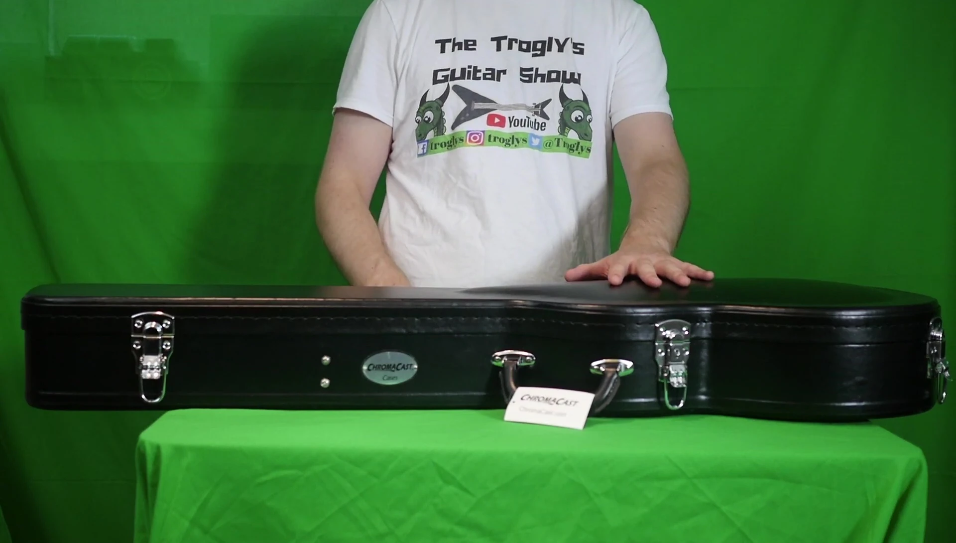 The ChromaCast Les Paul case sitting on a table, showcasing its exterior and latches.