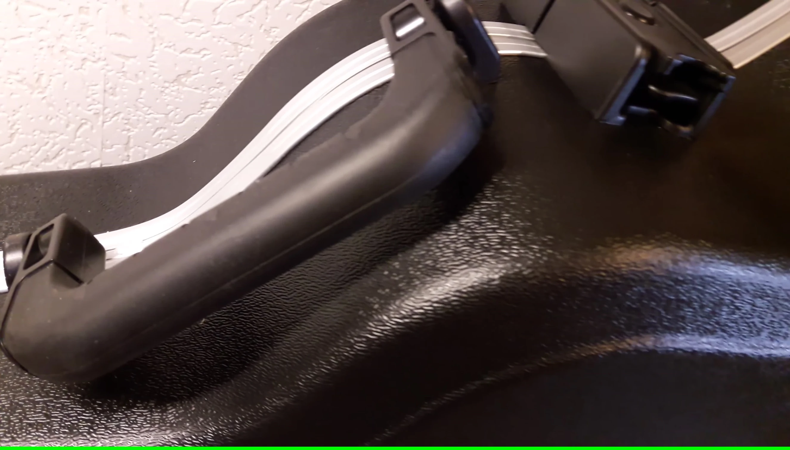 Close-up of the neck area, showcasing the slight bow in its design.