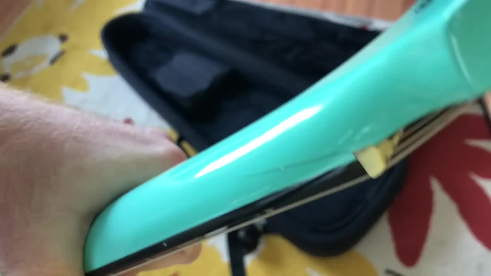 Close-up of the pre-existing damage around the neck joint of the guitar.