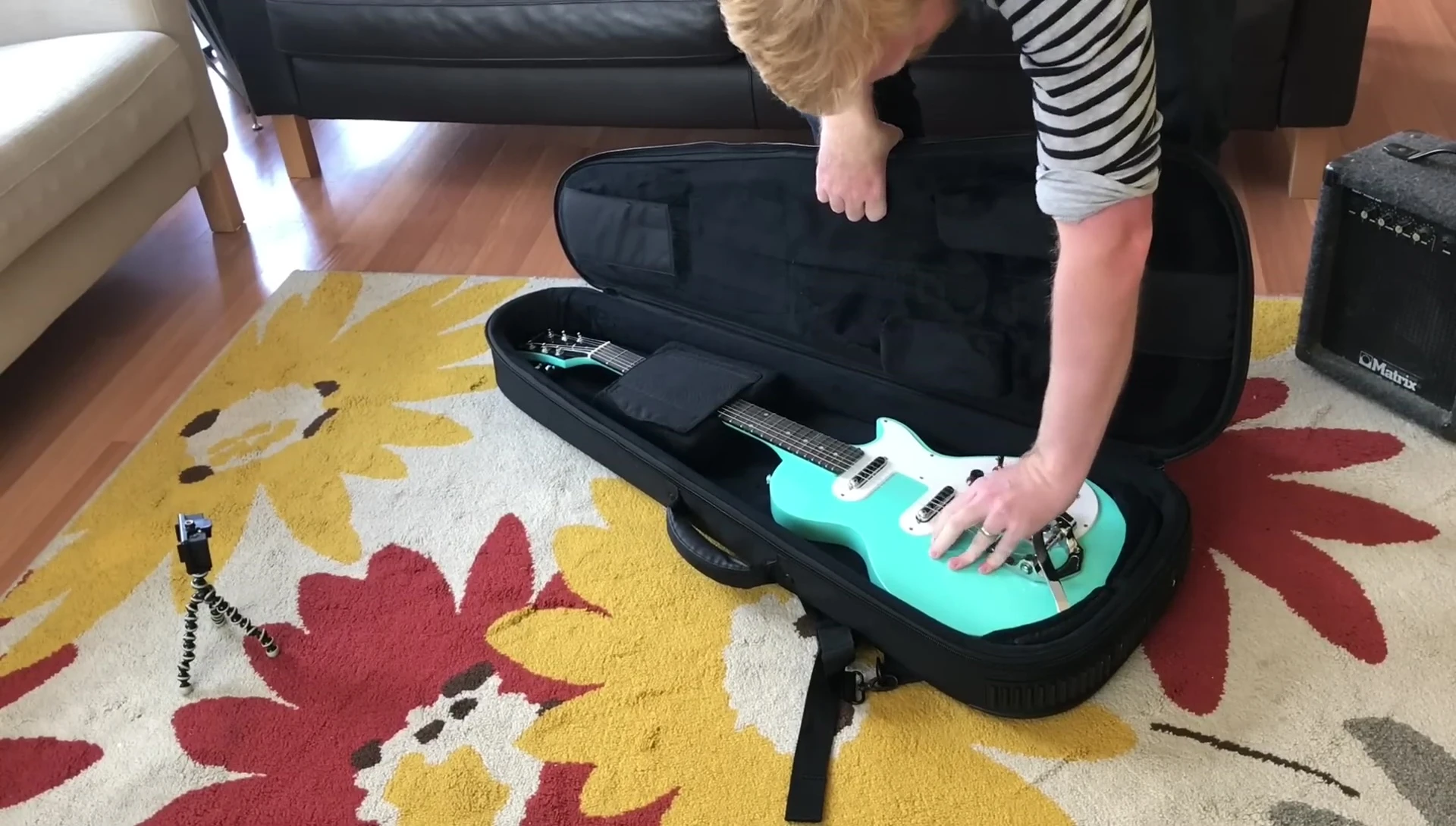 The guitar case after the targeted drop, showing no damage.