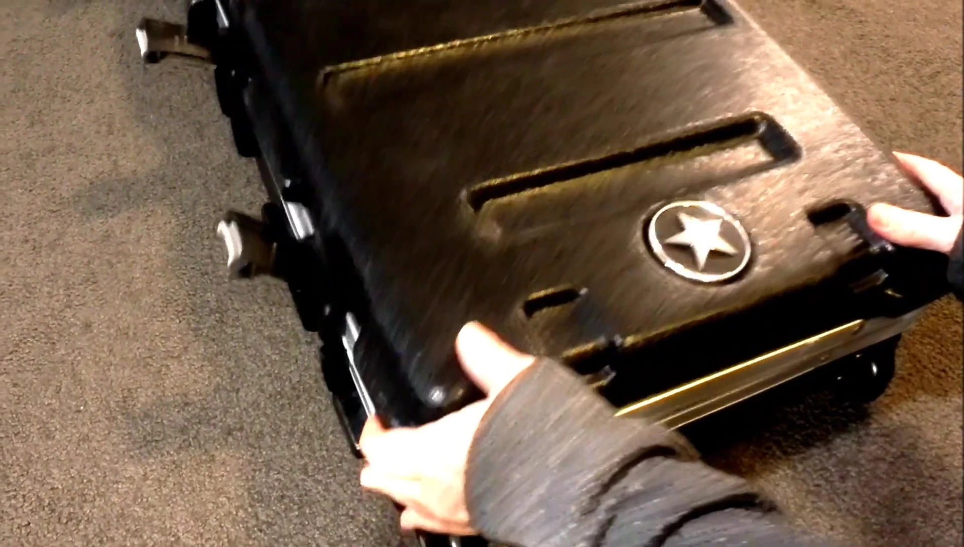 The reviewer measuring the internal length of the case.
