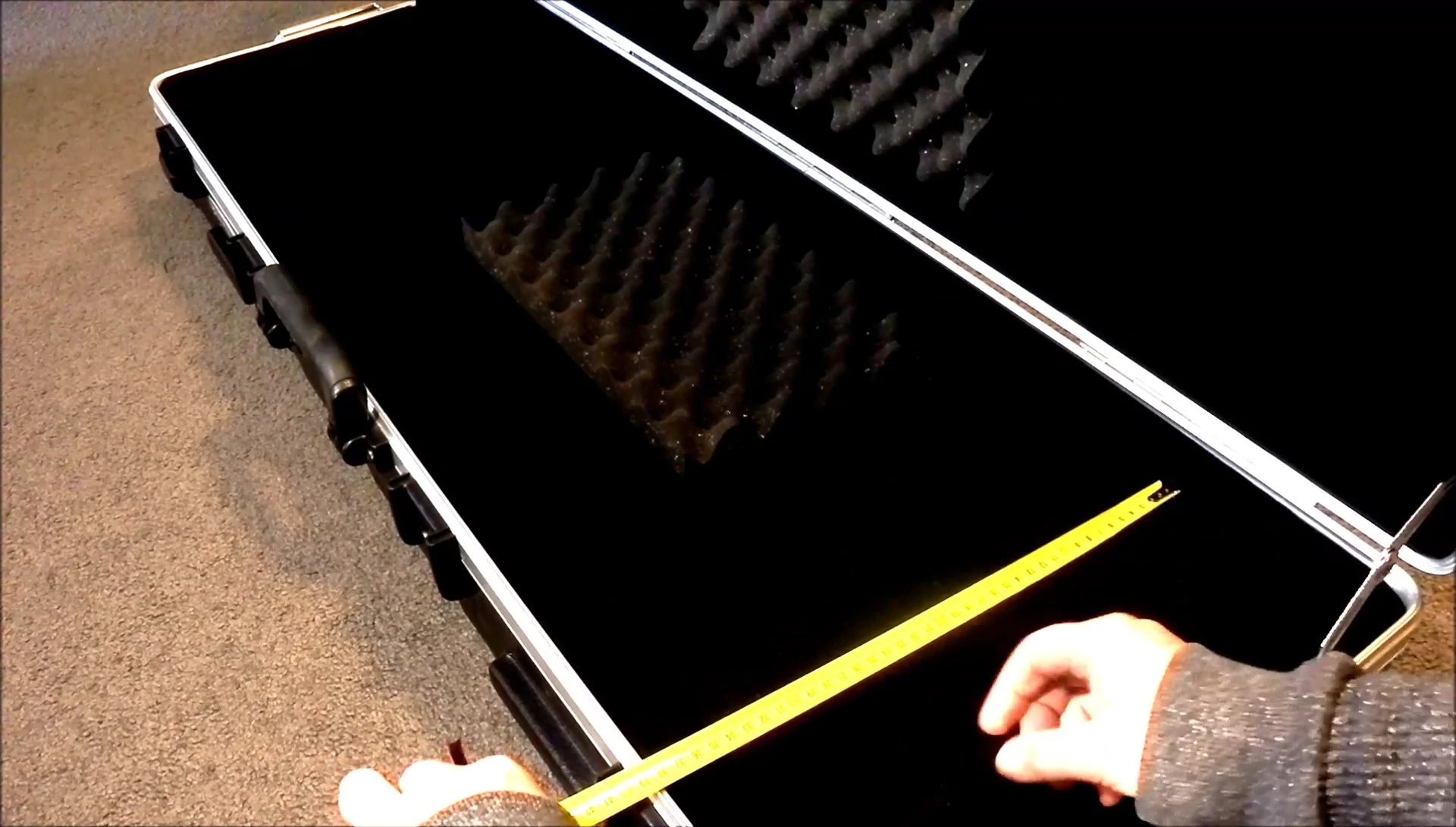 The reviewer discussing the case's depth and height capacity.