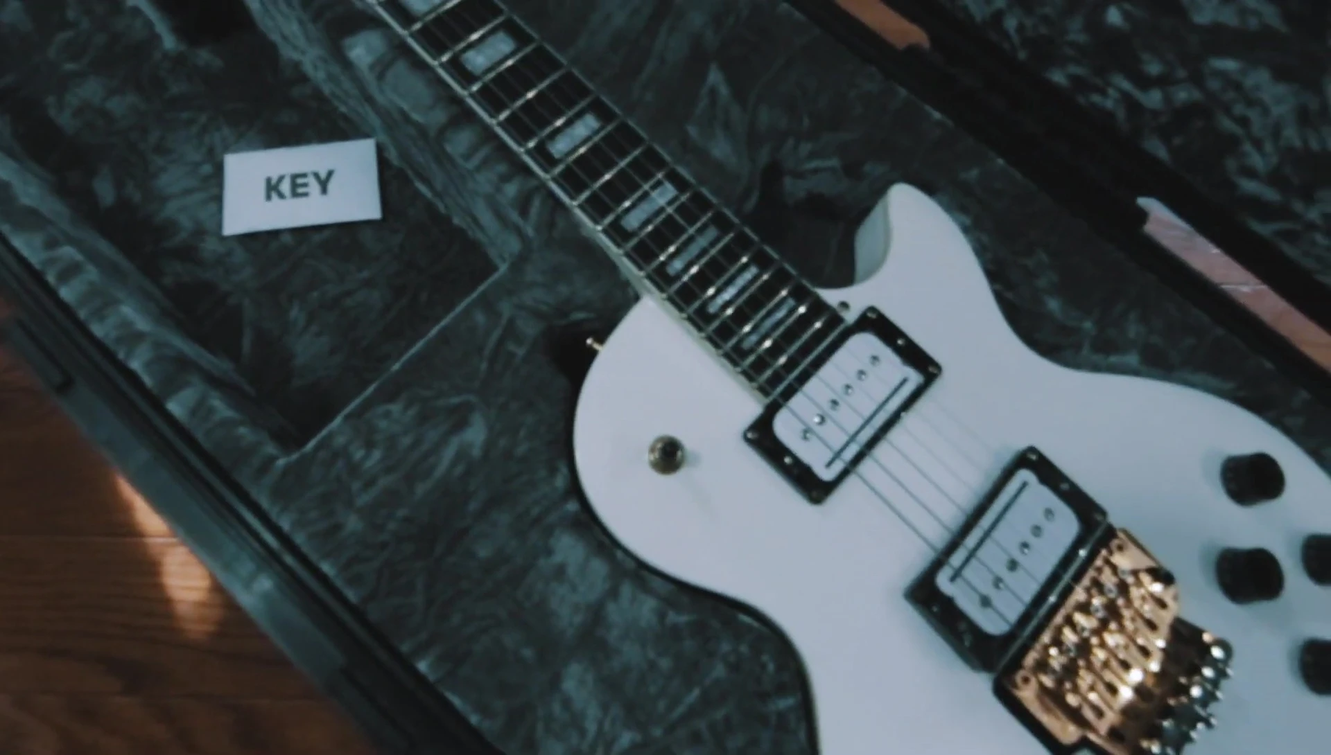 The guitar inside the SKB case, showing slight sinking.