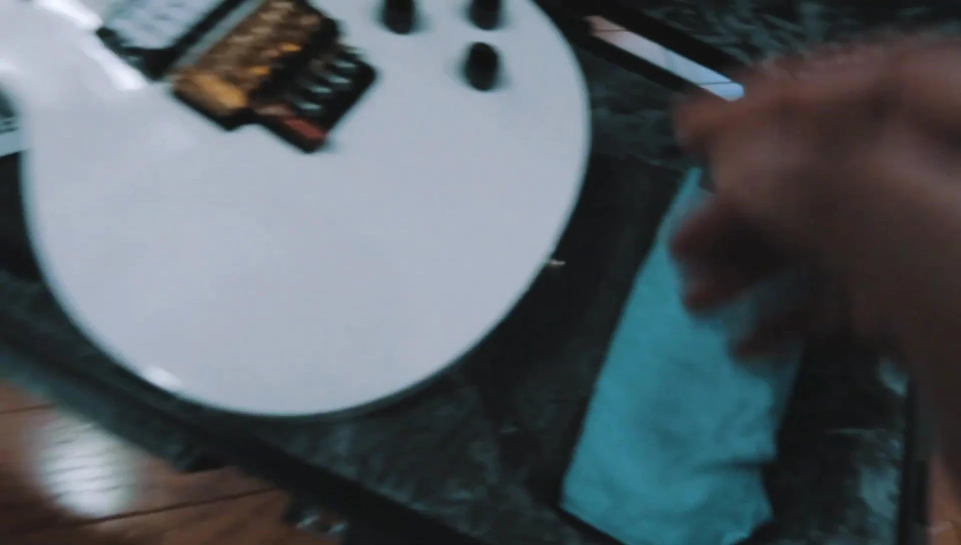 Adding extra cloth for support and preventing movement of the guitar.