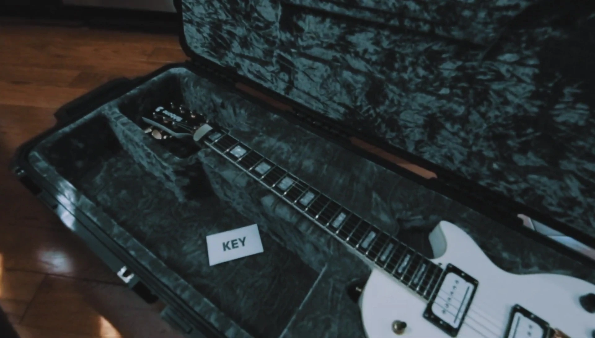 Final shot of the guitar securely placed within the case.