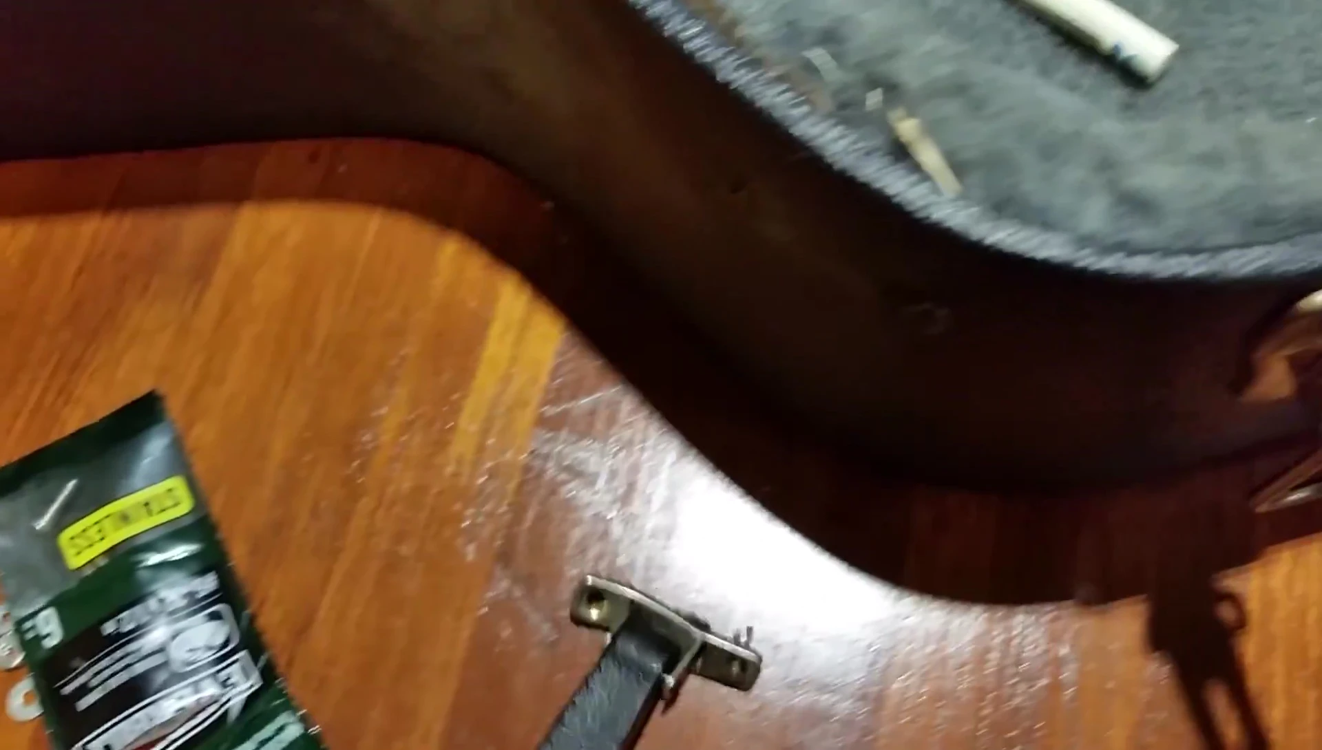 Close-up showing the discrepancy between the flat hardware and the curved case surface.