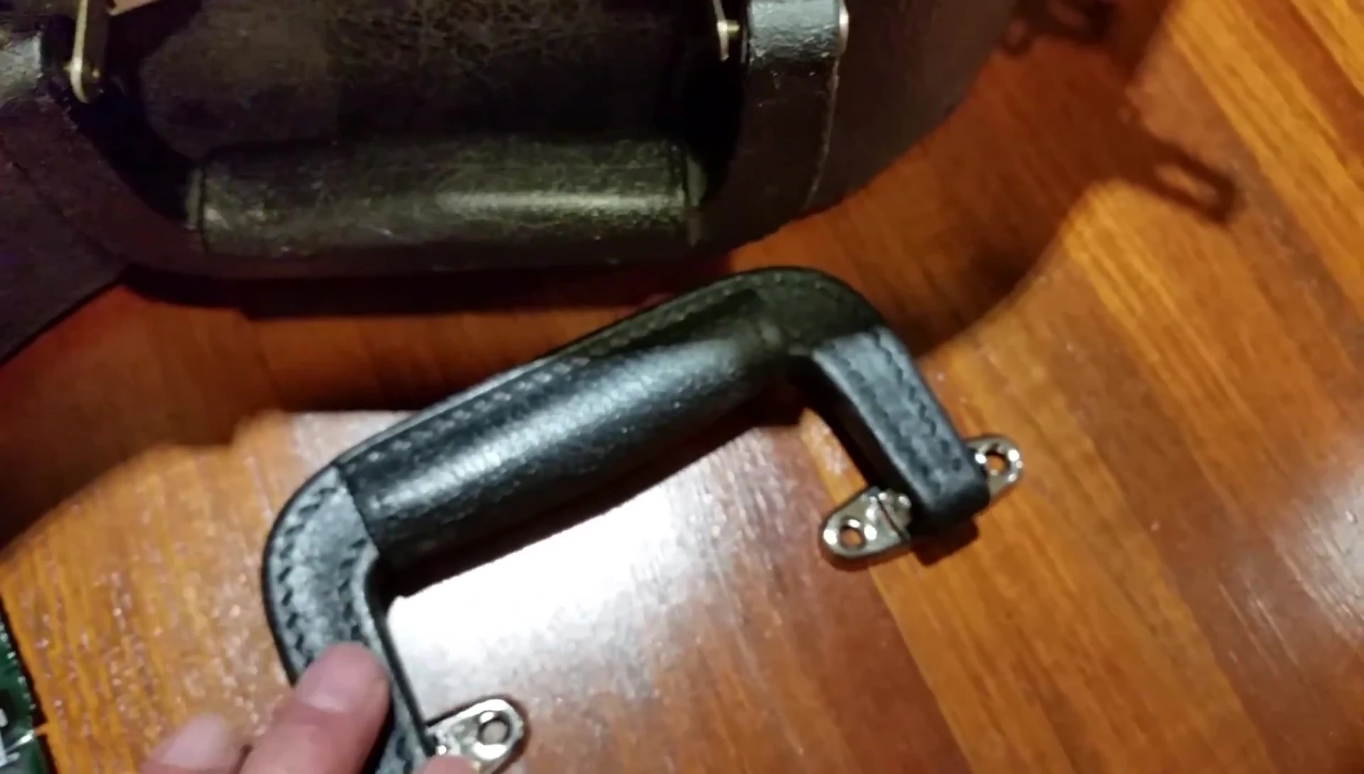 Comparison shot showing both the old and new handles.
