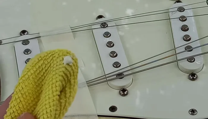 Apply silver polish to a Q-tip and dab onto the pole pieces. Let it haze, then polish off with a clean microfiber cloth.