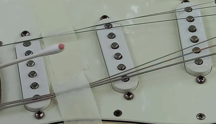 Apply silver polish to a Q-tip and dab onto the pole pieces. Let it haze, then polish off with a clean microfiber cloth.